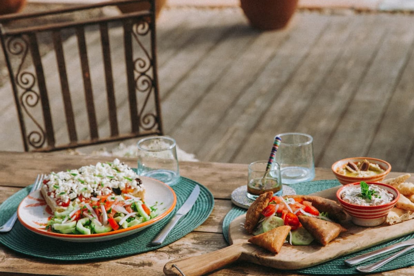 The midday menu laid on the wooden terrace, filled focaccia, salad and mezze